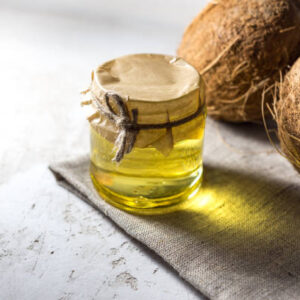 Coconut and bottle of coconut palm oil. healthy food vegan aromatherapy